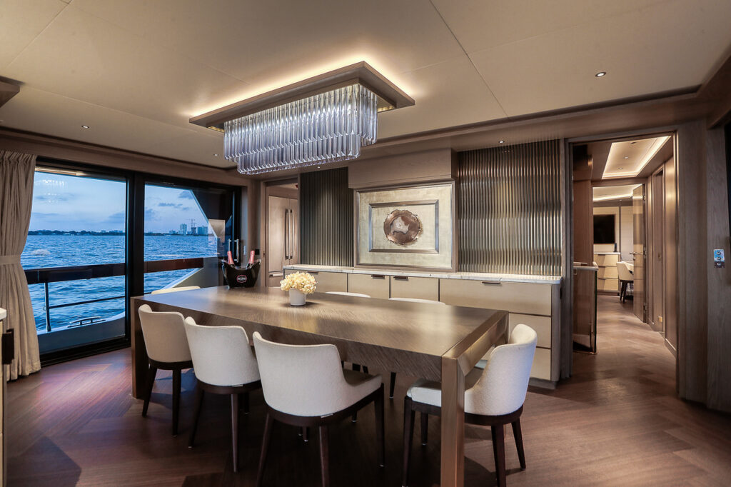 Sleek modern dining interior aboard 88 Sirena luxury yacht Miami