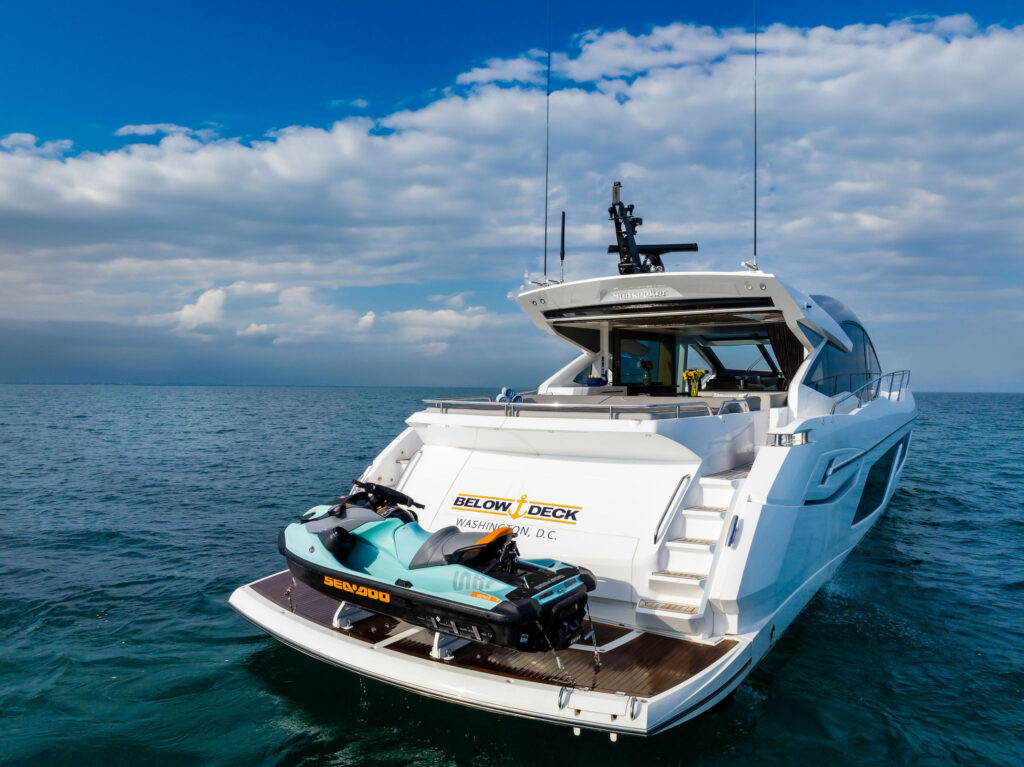 Floating water carpet and guests enjoying Miami turquoise waters on Sunseeker Predator yacht charter