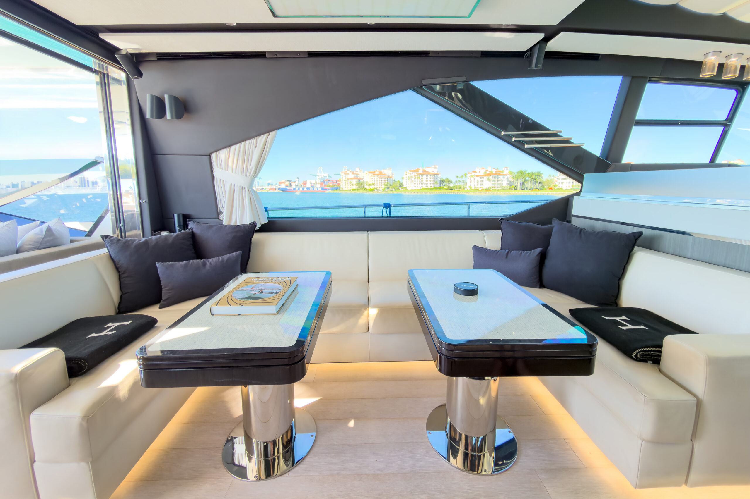 Bright modern salon with plush seating and expansive windows aboard Azimut 7S Ocean Flair