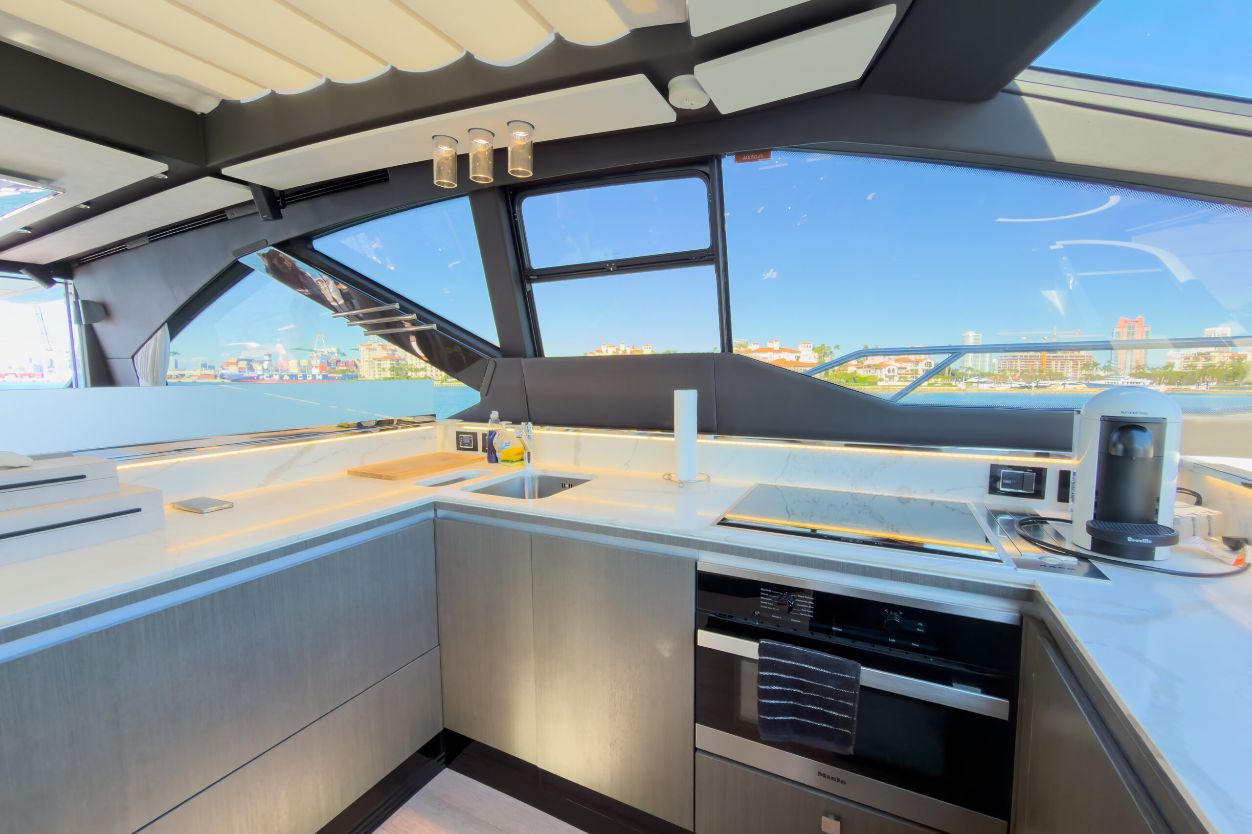 Fully-equipped contemporary galley kitchen with premium appliances on Azimut yacht charter Miami