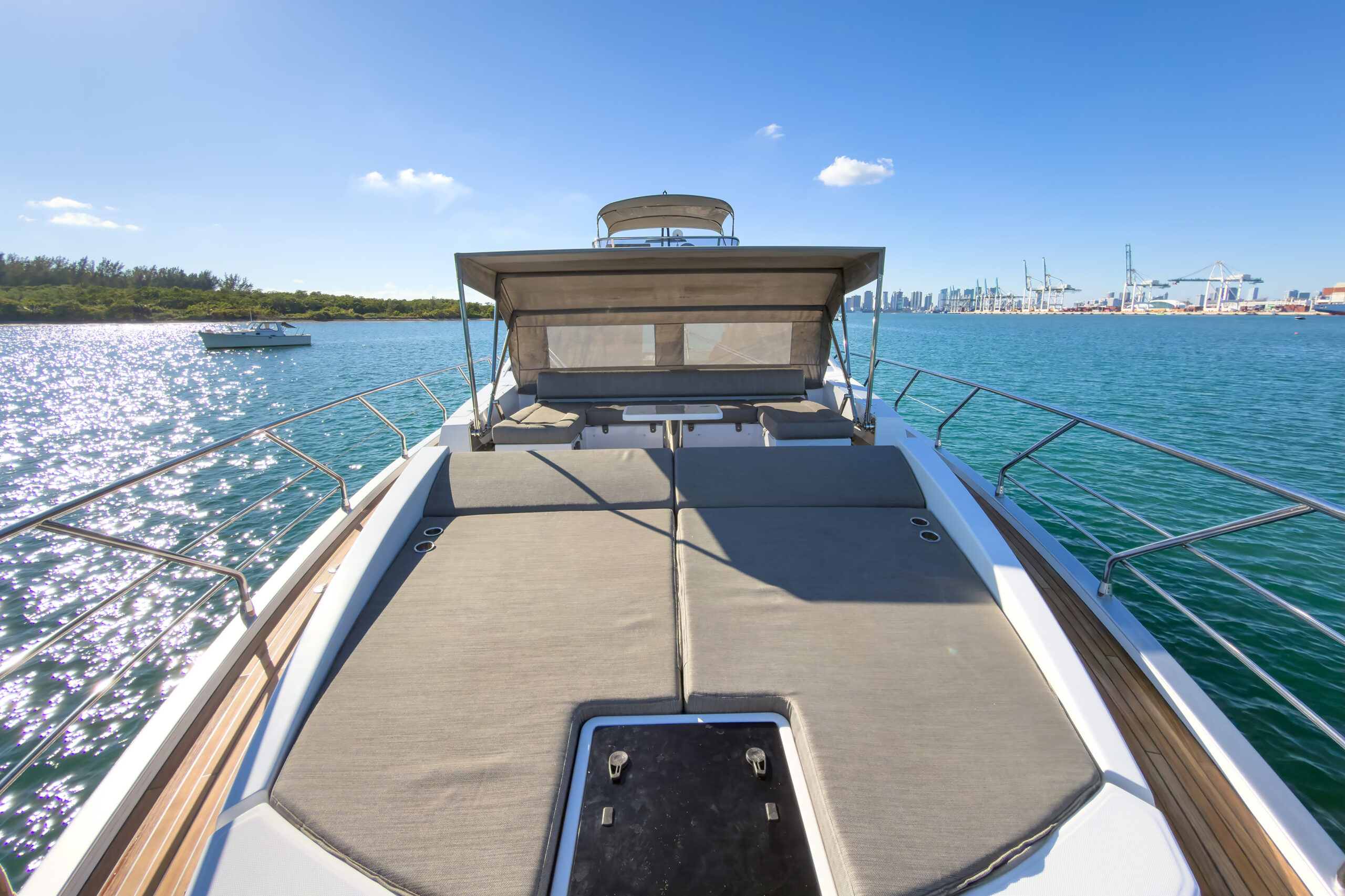 Spacious bow deck with cushioned lounges for sunbathing on 72-foot Azimut luxury yacht