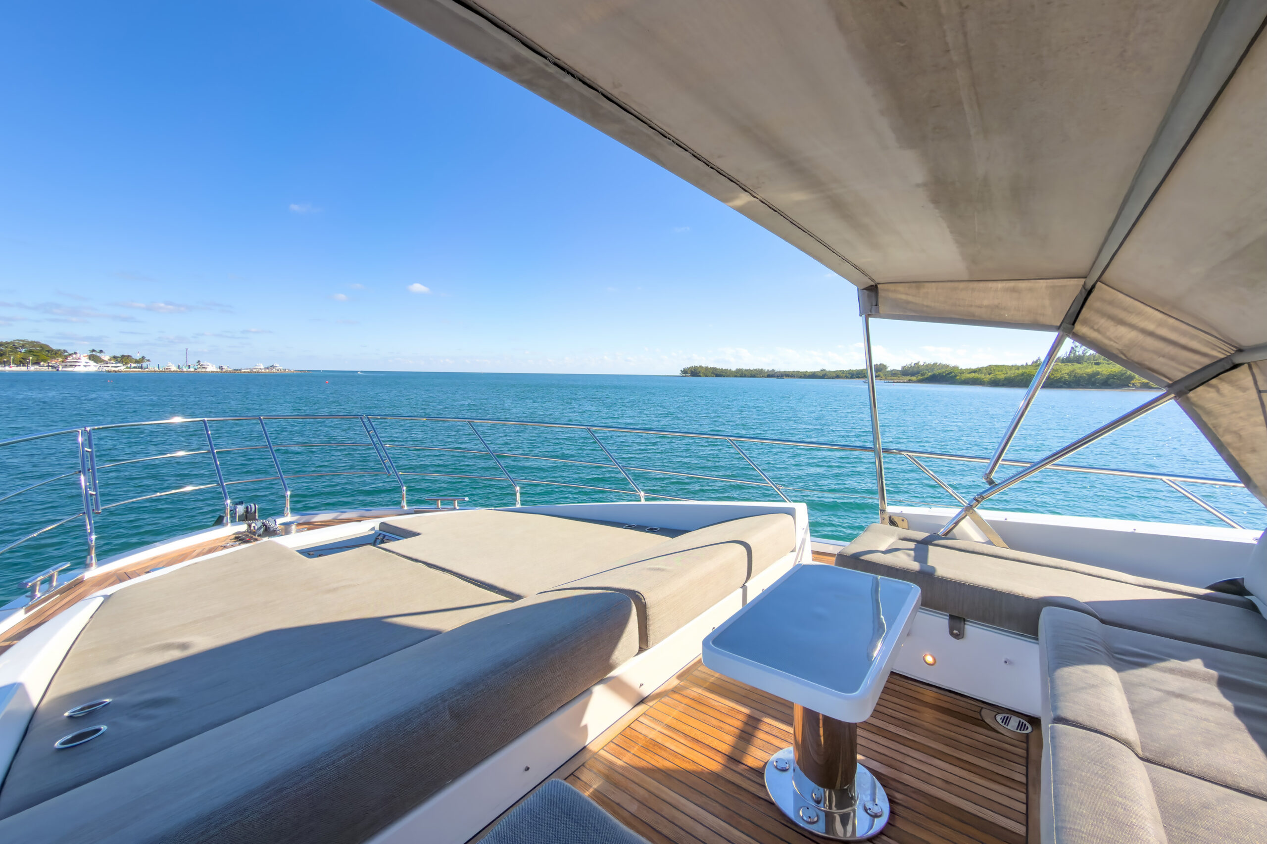 Spacious bow deck with cushioned lounges for sunbathing on 72-foot Azimut luxury yacht