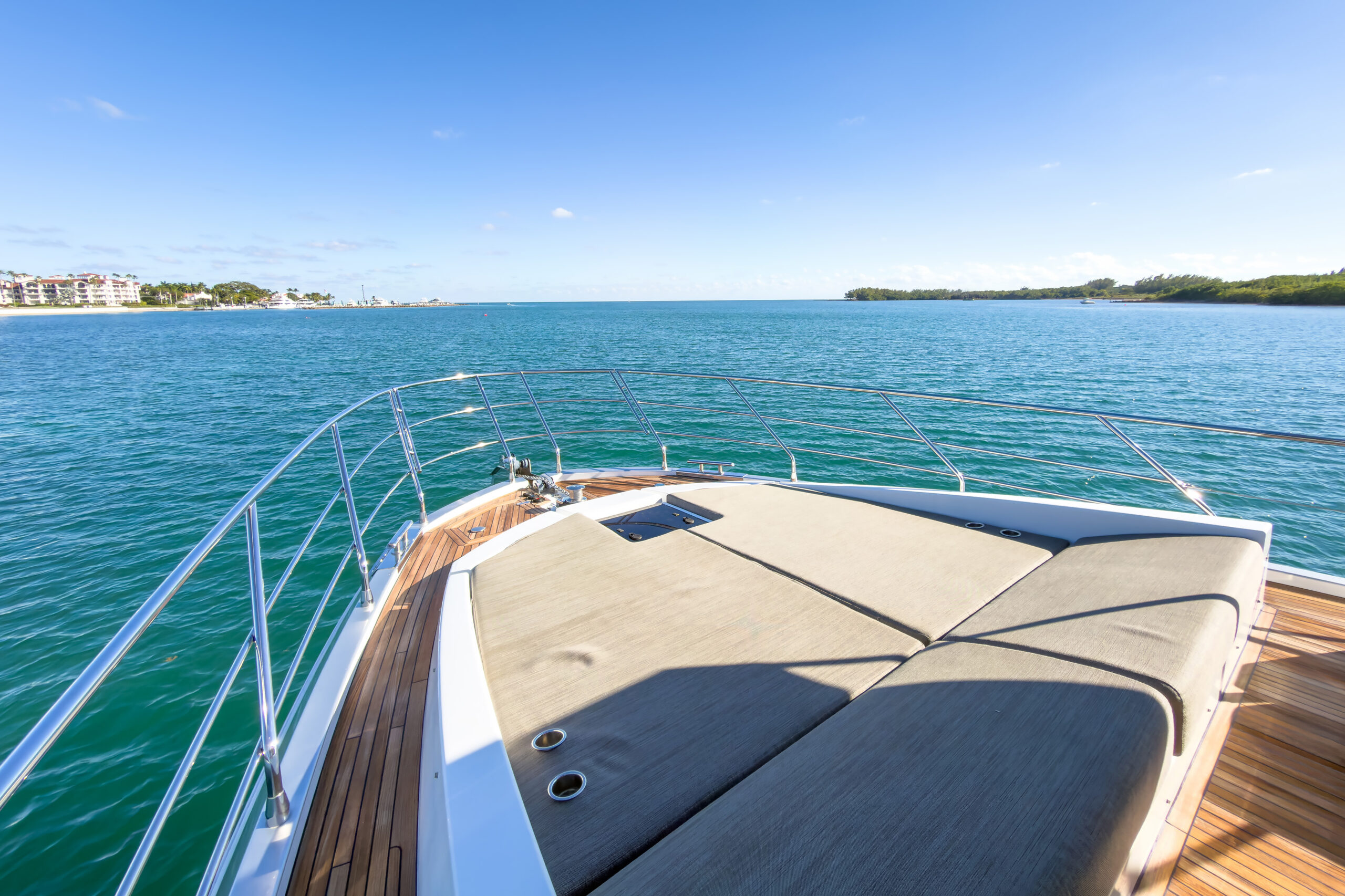 Spacious bow deck with cushioned lounges for sunbathing on 72-foot Azimut luxury yacht