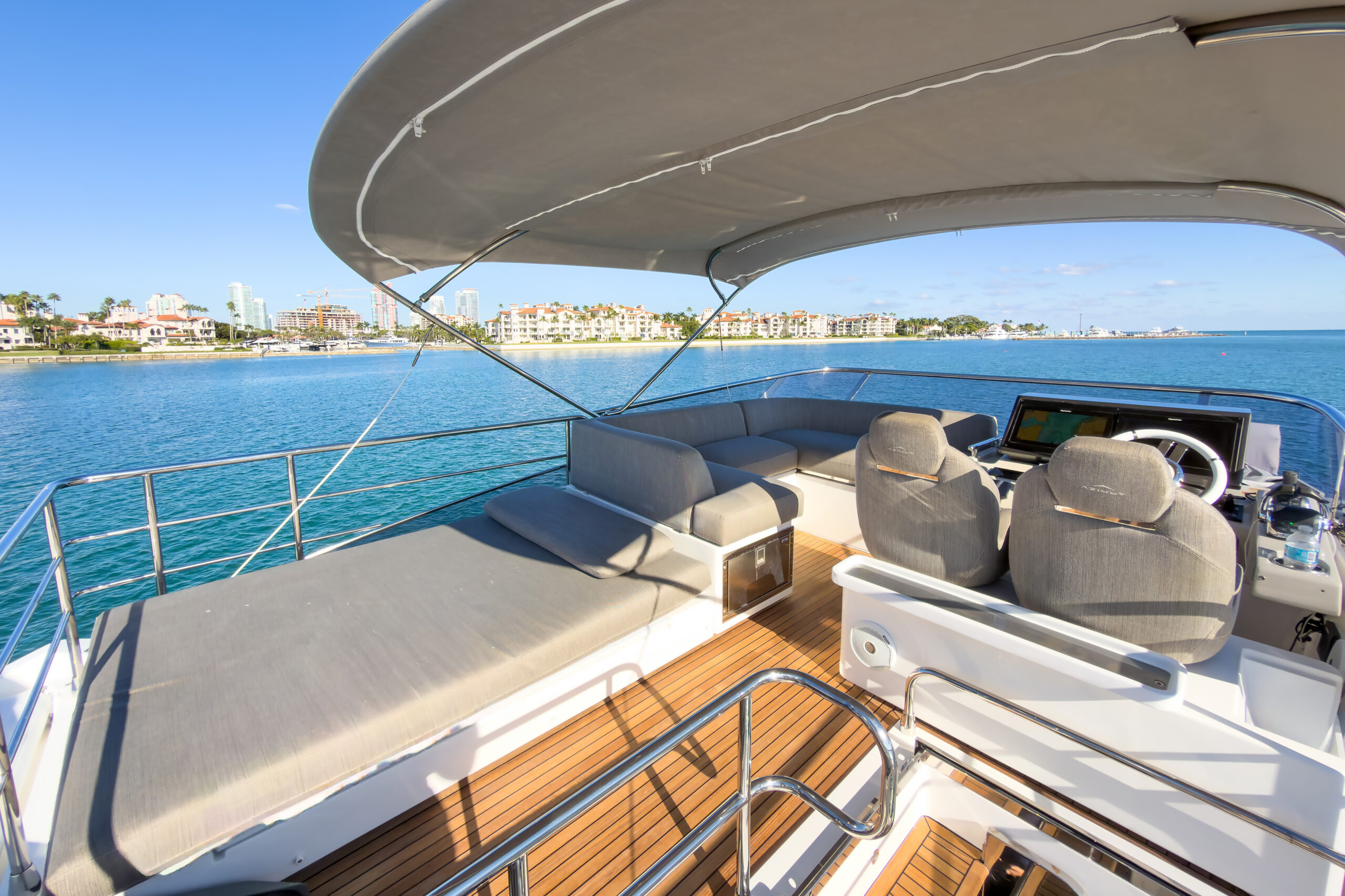 Spacious bow deck with cushioned lounges for sunbathing on 72-foot Azimut luxury yacht